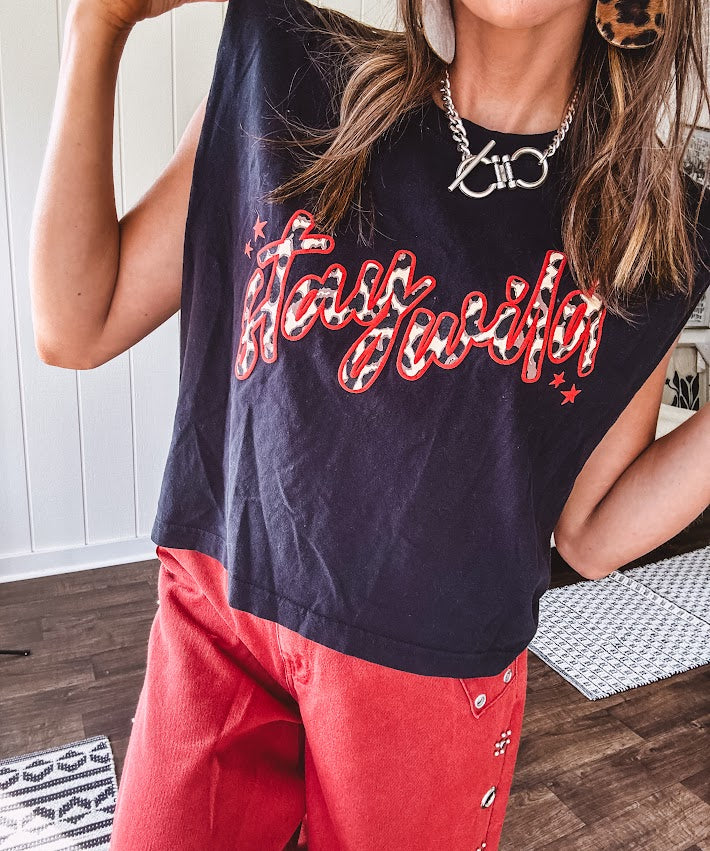 This sleek black cotton tank features a fierce leopard print "stay wild" graphic trimmed in vibrant red, giving you that edgy, untamed vibe.
