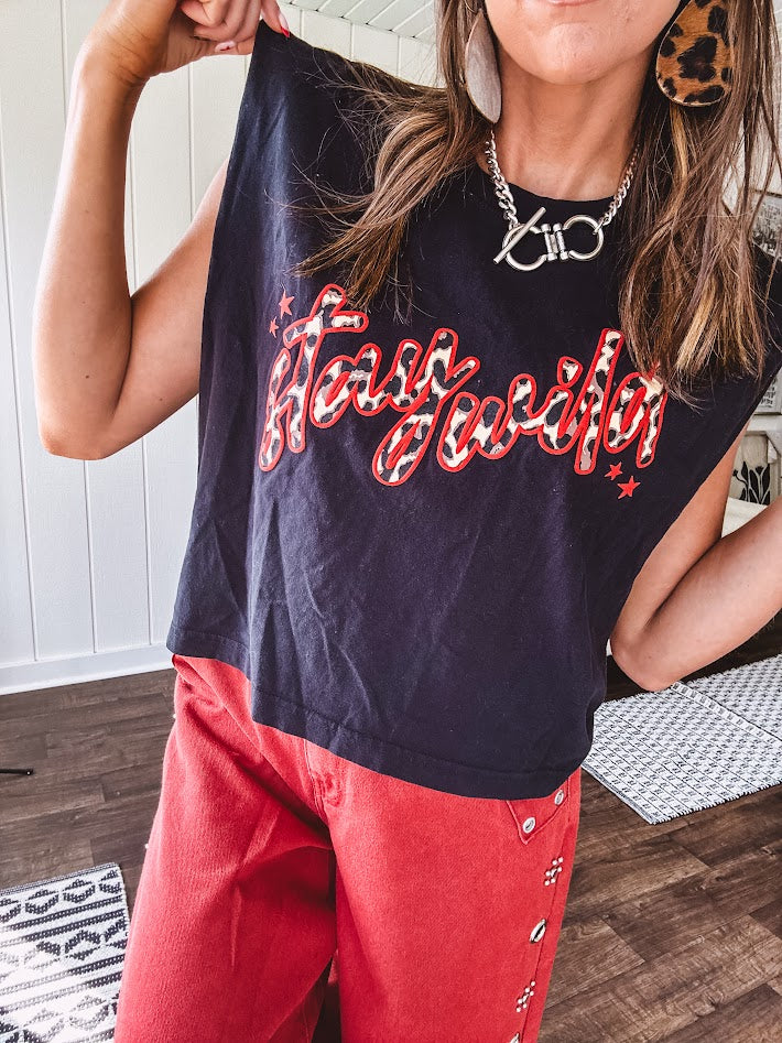 This sleek black cotton tank features a fierce leopard print "stay wild" graphic trimmed in vibrant red, giving you that edgy, untamed vibe.
