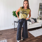 These vintage-inspired wide leg pants are a total vibe—low-rise silhouette with playful silver eyelets and studs running down the sides that catch the light just right. Crafted from lightweight 100% cotton denim with that perfect worn-in wash. The button and zipper closure with elastic back waist keeps them comfortable all day long. Ultra-wide legs that make a statement.