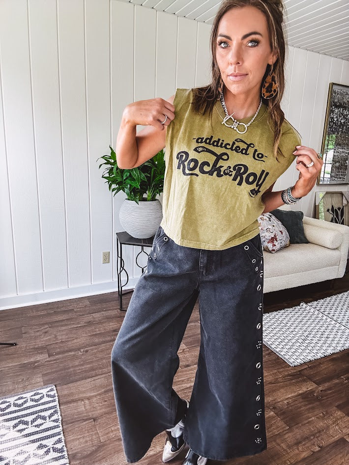 Washed olive tank with bold black "Addicted to Rock & Roll" graphic and shorter hemline. 100% Cotton.
