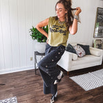 Washed olive tank with bold black "Addicted to Rock & Roll" graphic and shorter hemline. 100% Cotton.