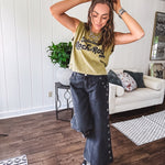 These vintage-inspired wide leg pants are a total vibe—low-rise silhouette with playful silver eyelets and studs running down the sides that catch the light just right. Crafted from lightweight 100% cotton denim with that perfect worn-in wash. The button and zipper closure with elastic back waist keeps them comfortable all day long. Ultra-wide legs that make a statement.