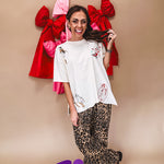 Ivory tee featuring western inspired graphics.