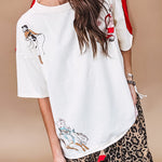 Ivory tee featuring western inspired graphics.