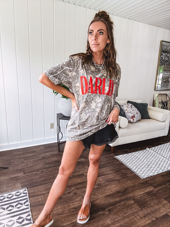 Light camo cotton tee with a bold, contrasting red "DARLIN'" graphic