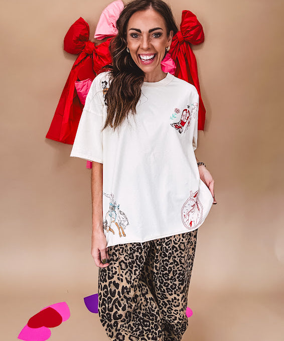 Ivory tee featuring western inspired graphics.