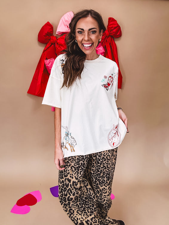 Ivory tee featuring western inspired graphics.