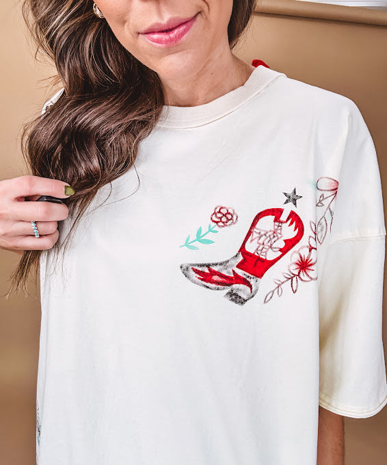 Ivory tee featuring western inspired graphics.