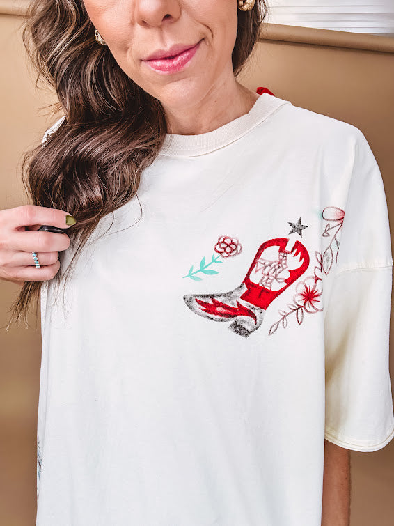 Ivory tee featuring western inspired graphics.