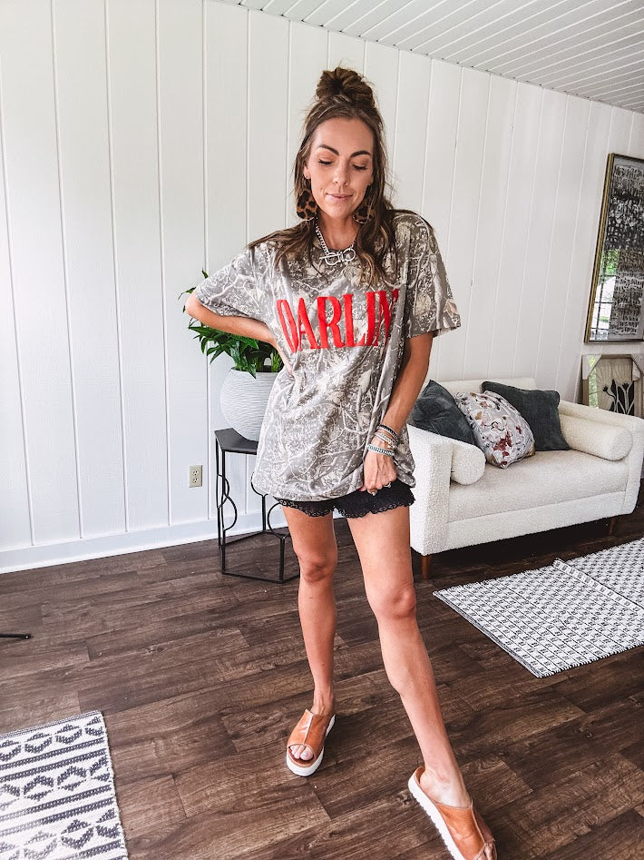 Light camo cotton tee with a bold, contrasting red "DARLIN'" graphic