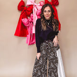 Cotton wide leg pants in a dark chocolate, white and black leo print with a white and black wide stripe panel down the side with button fly.