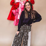 Cotton wide leg pants in a dark chocolate, white and black leo print with a white and black wide stripe panel down the side with button fly.
