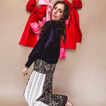 Cotton wide leg pants in a dark chocolate, white and black leo print with a white and black wide stripe panel down the side with button fly.