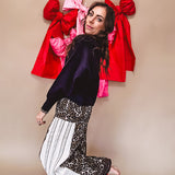 Cotton wide leg pants in a dark chocolate, white and black leo print with a white and black wide stripe panel down the side with button fly.
