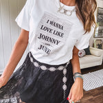 Crisp white cotton tee with a shorter hemline and bold newsprint graphic celebrating iconic love—"I Wanna Love Like Johnny and June."