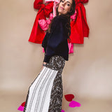 Cotton wide leg pants in a dark chocolate, white and black leo print with a white and black wide stripe panel down the side with button fly.