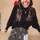 Round neck, crew style cropped sweater with drop shoulder available in black, white and wine.