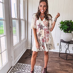 Cream V-neck mini dress with red, taupe, and leopard hearts and stars, lace overlay, ruffled puff sleeves, and an elastic hem. The stretchy, flowy silhouette flatters and flows.