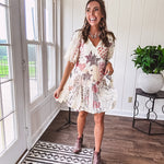 Cream V-neck mini dress with red, taupe, and leopard hearts and stars, lace overlay, ruffled puff sleeves, and an elastic hem. The stretchy, flowy silhouette flatters and flows.