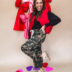 Vibrant true red puffer vest with zipper front and pockets.