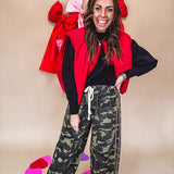 Vibrant true red puffer vest with zipper front and pockets.
