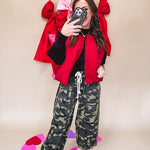 Vibrant true red puffer vest with zipper front and pockets.