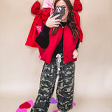 Vibrant true red puffer vest with zipper front and pockets.