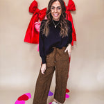 Dark mustard and black leo drawstring waist pants with wide leg.