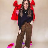 Dark mustard and black leo drawstring waist pants with wide leg.