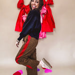 Dark mustard and black leo drawstring waist pants with wide leg.