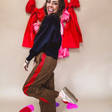 Dark mustard and black leo drawstring waist pants with wide leg.