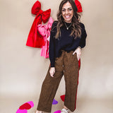 Dark mustard and black leo drawstring waist pants with wide leg.