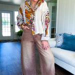 Short hem cotton long sleeved top with boho floral pint patchwork throughout and lace inserts and front pocket with silver button front, Earth tones.