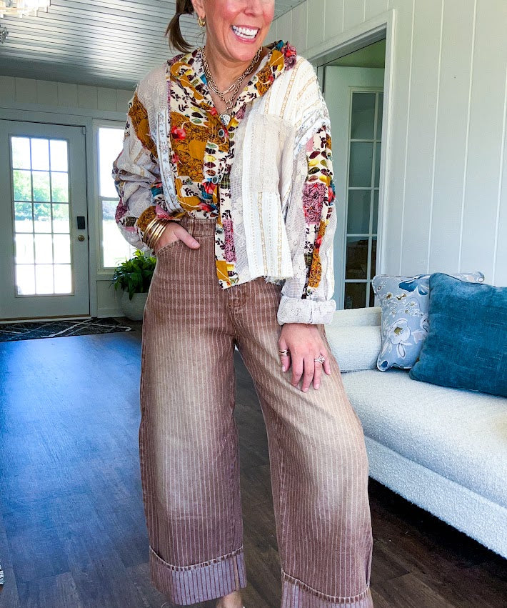 Short hem cotton long sleeved top with boho floral pint patchwork throughout and lace inserts and front pocket with silver button front, Earth tones.
