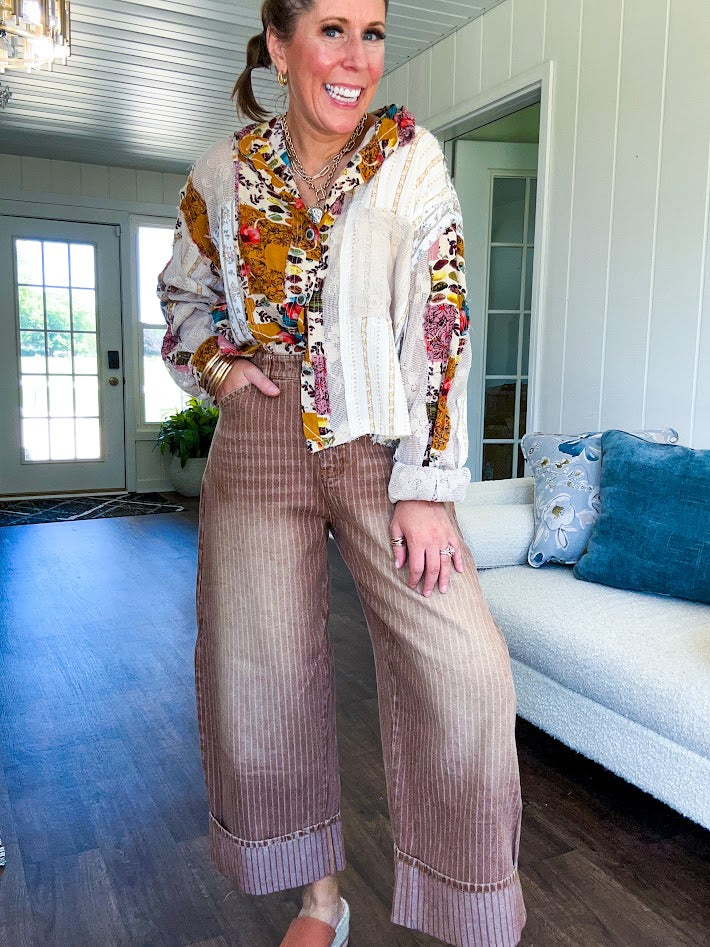Short hem cotton long sleeved top with boho floral pint patchwork throughout and lace inserts and front pocket with silver button front, Earth tones.