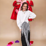 Round neck, crew style cropped sweater with drop shoulder available in black, white and wine.