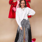Round neck, crew style cropped sweater with drop shoulder available in black, white and wine.