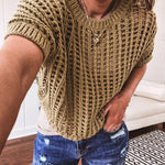 Open weave short sleeved waist length sweater available in many colors.