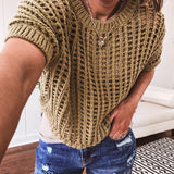 Open weave short sleeved waist length sweater available in many colors.