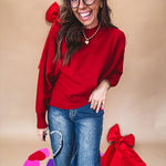 Round neck, crew style cropped sweater with drop shoulder available in black, white and wine.