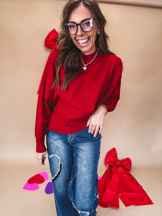 Round neck, crew style cropped sweater with drop shoulder available in black, white and wine.