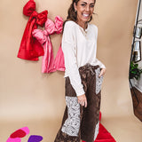 Drop shoulder three button round neck long sleeved top.