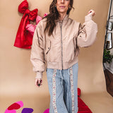 Tan puffer bomber jacket with zipper front and side pockets.