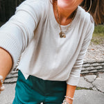 Soft brushed Hacci style pullover with long sleeves.
