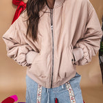 Tan puffer bomber jacket with zipper front and side pockets.