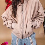 Tan puffer bomber jacket with zipper front and side pockets.