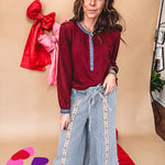 Burgundy Henley style long sleeved top with denim trim at 1/4 button down front, collar and cuffs.