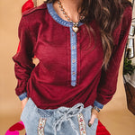 Burgundy Henley style long sleeved top with denim trim at 1/4 button down front, collar and cuffs.