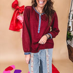 Burgundy Henley style long sleeved top with denim trim at 1/4 button down front, collar and cuffs.
