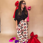 Cream wide leg pants with a spice and chocolate playing card motif pattern, elastic back waist and functional side pockets.